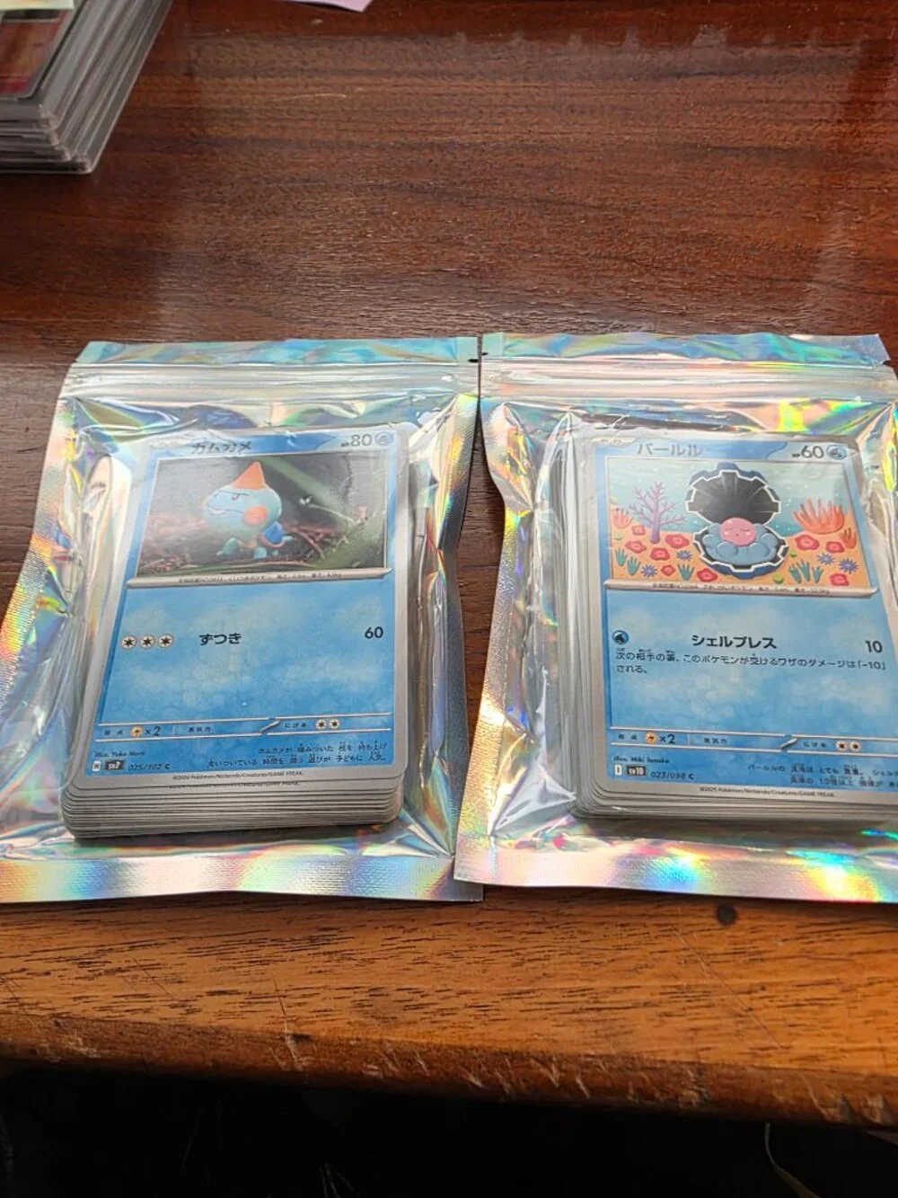 LARGE LOT OF VARIOUS POKEMON/JAPANESE , PAD, COINS, SLABBED CARDS ALL BRAND NEW